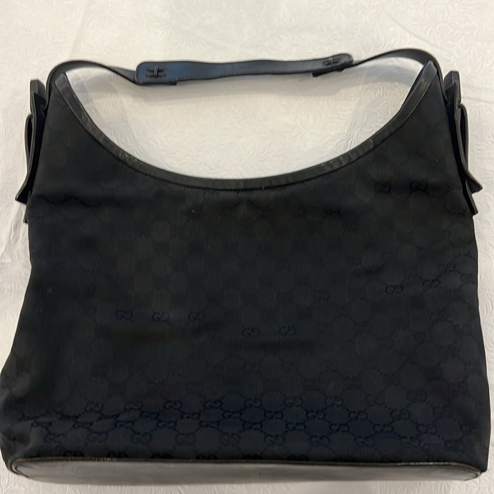 Authentic Gucci monogram black hobo bag.